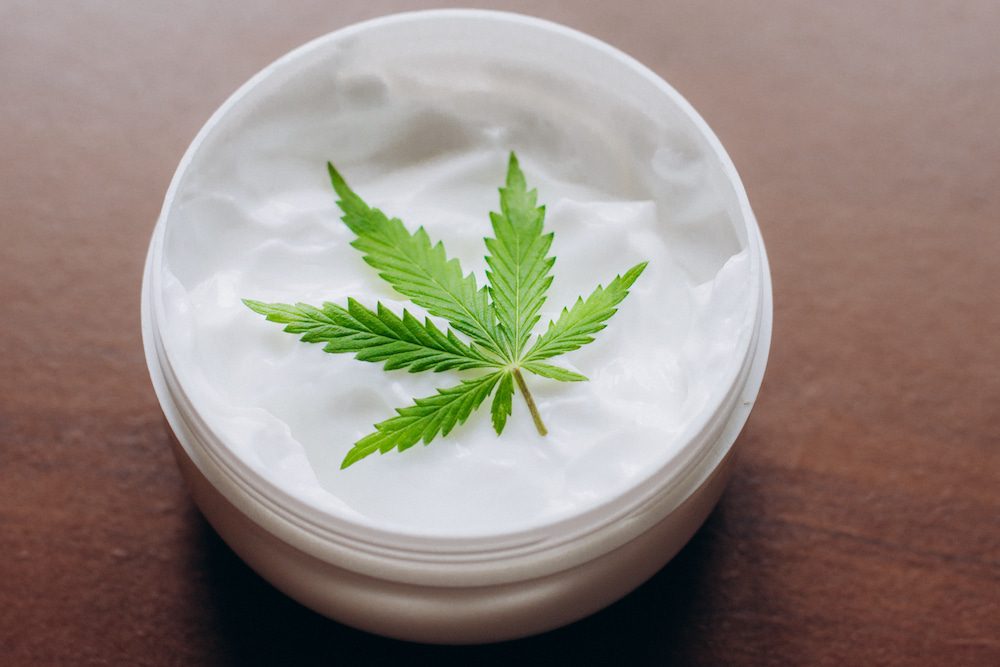 A container of CBD cream