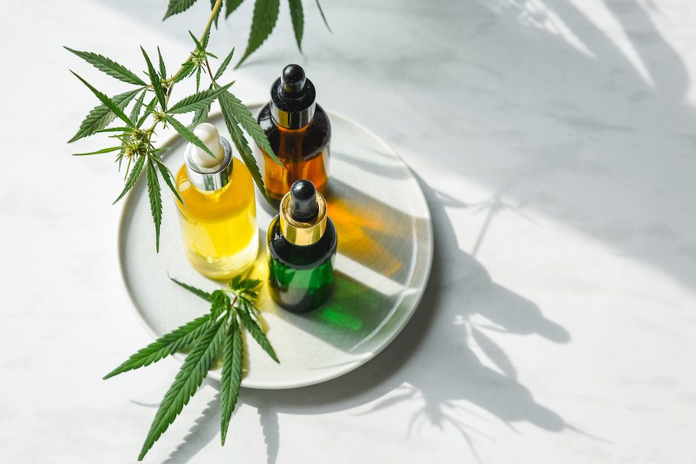 CBD oils and face serums on a tray