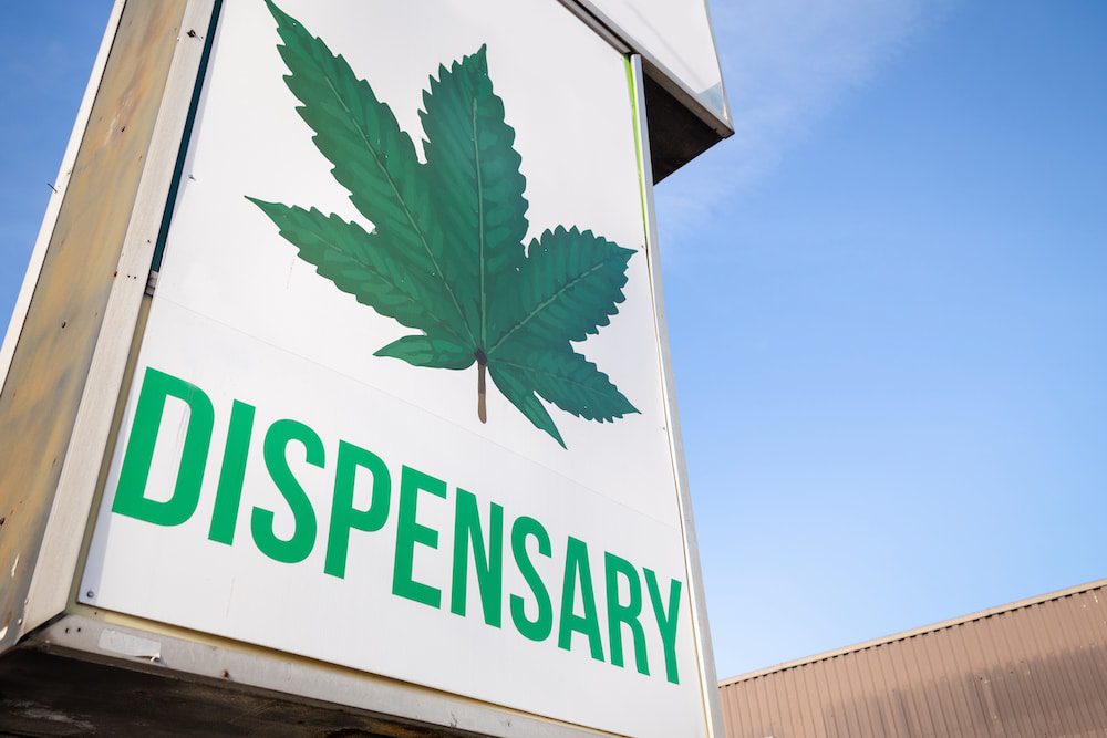 An outdoor sign for a cannabis dispensary