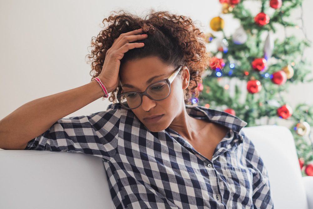A young woman struggling with holiday stress