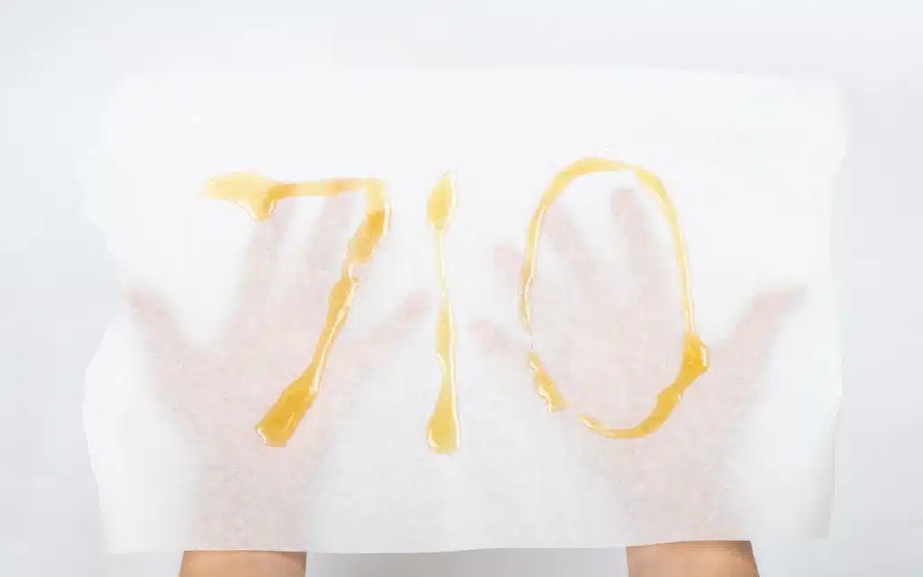 710 spelled in cannabis concentrate on parchment paper